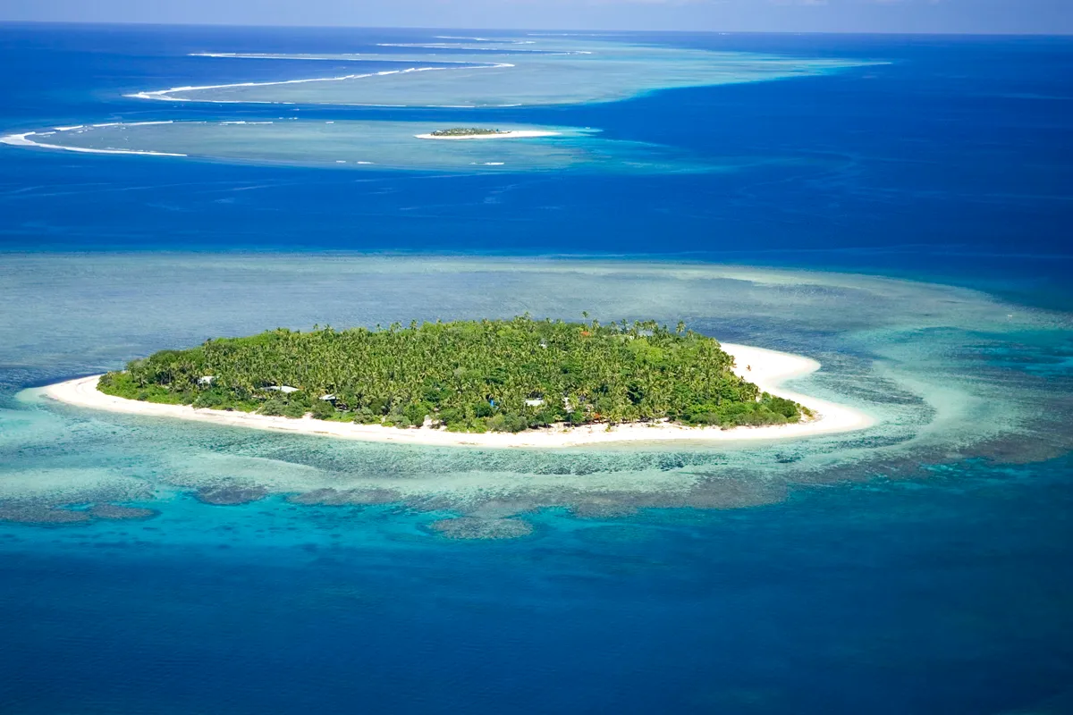 Aerial view of Tavarua Island and its reef in the Mamanucas, Fiji