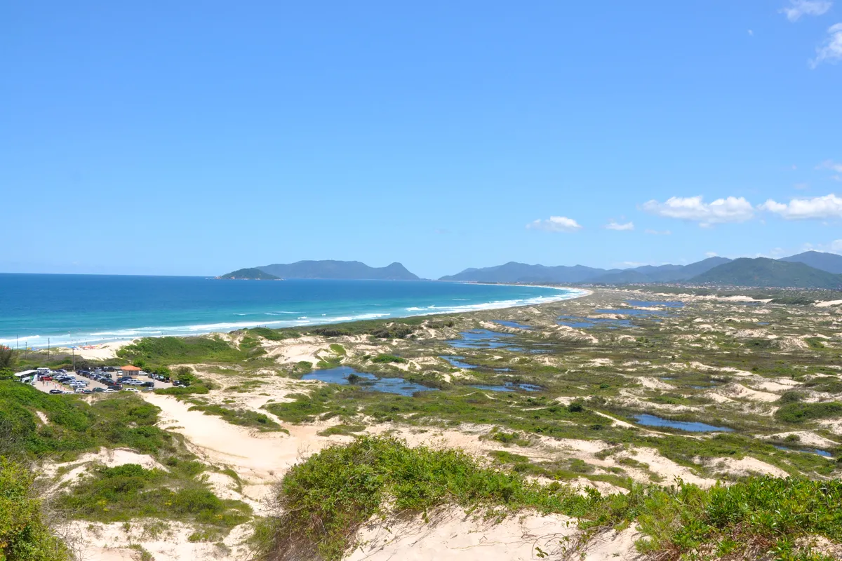 The dunes behind Praia da Joaquina, Florianópolis, with the coast beyond