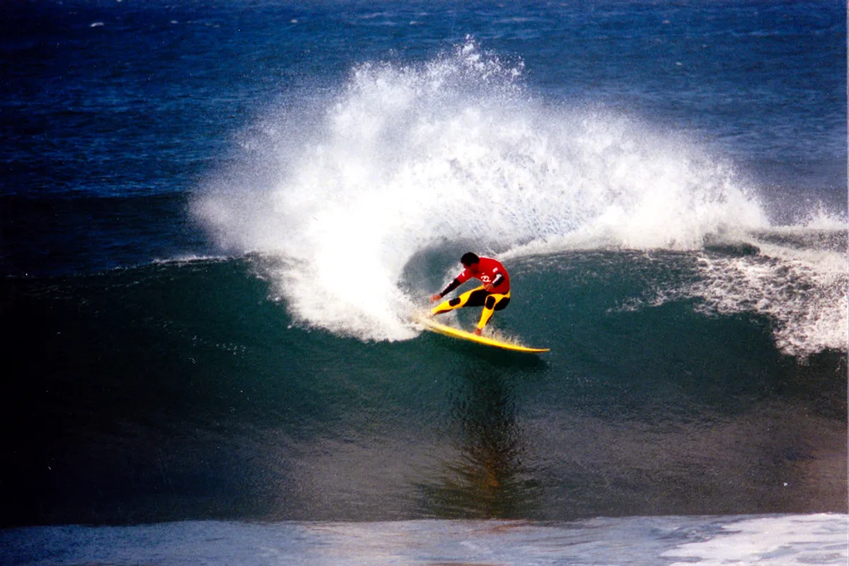 A surfer driving a powerful cutback on a Jeffreys Bay right-hander