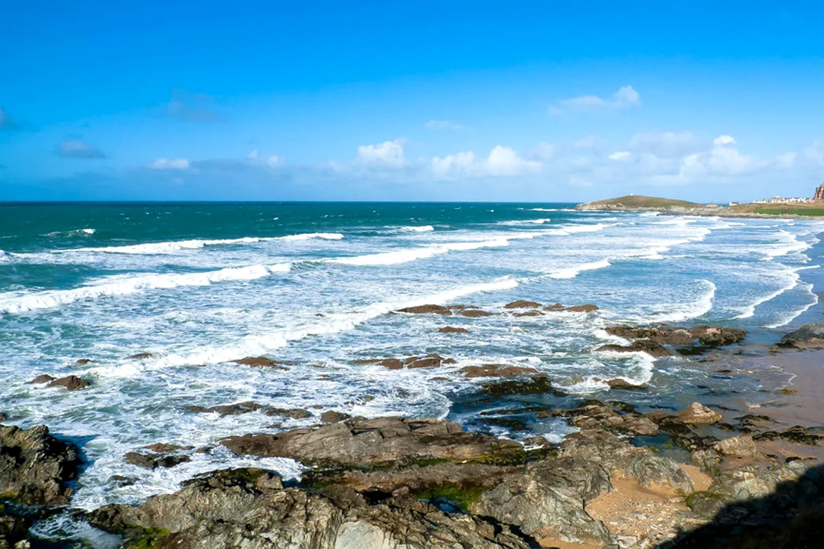 Morning light over the waves and rocks at Fistral Beach, Newquay