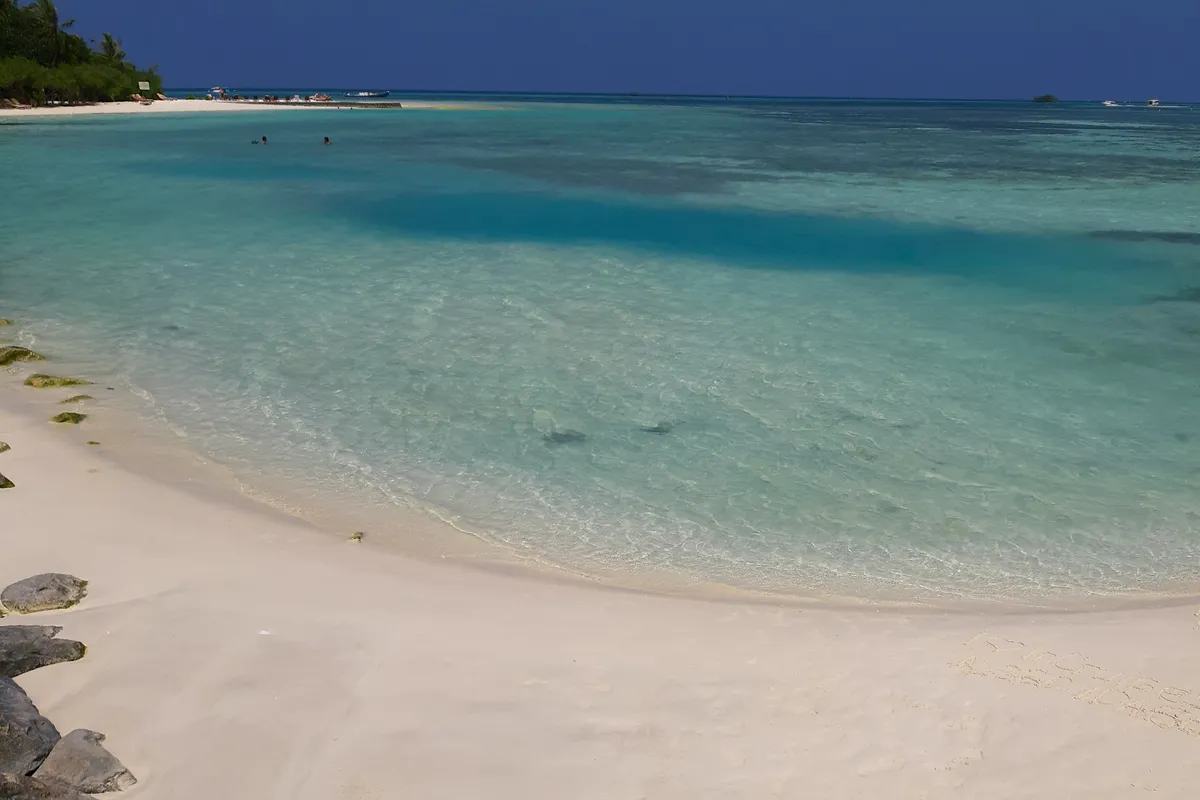 A white-sand beach and turquoise lagoon at Huraa, North Malé Atoll