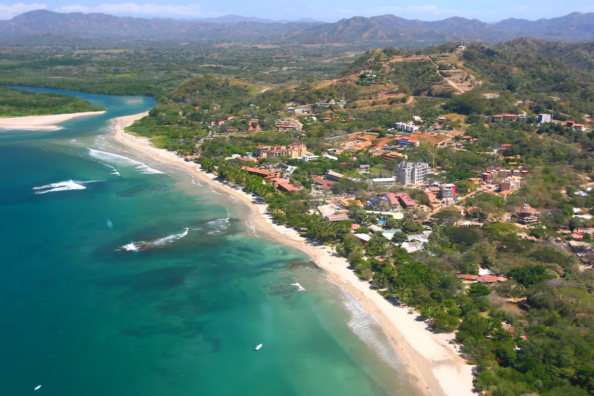 Aerial view of Playa Tamarindo and its river mouth, Guanacaste